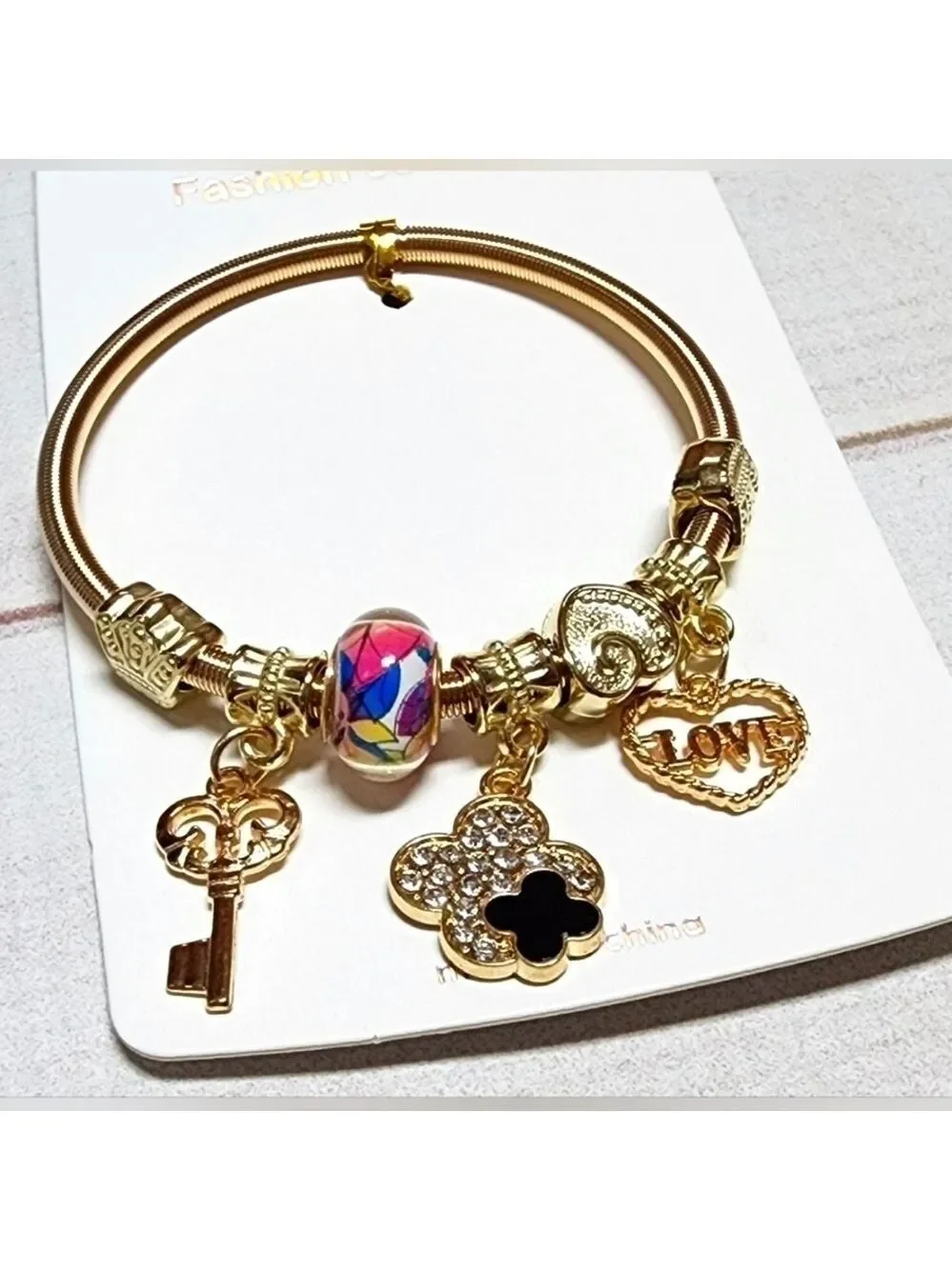 New Gold Sliding Charm Spring Bracelet